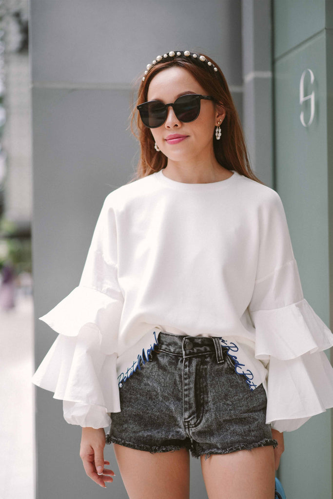 female model in casual top by petit moi