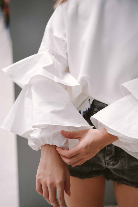 ruffles on casual and versatile top by petit moi