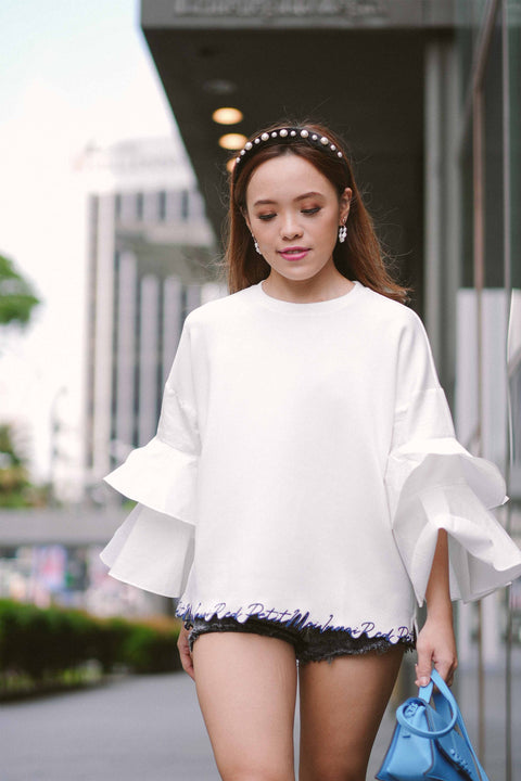 female model in white blouse by petit moi