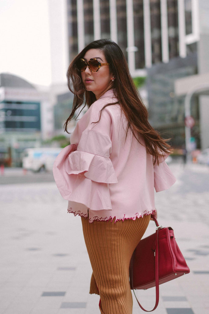 pregnant mother in pink blouse by petit moi