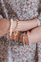 Woman wearing high quality assorted bracelets made by petit moi
