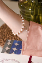 Closeup shot of bracelet on female model's hand. made by petit moi