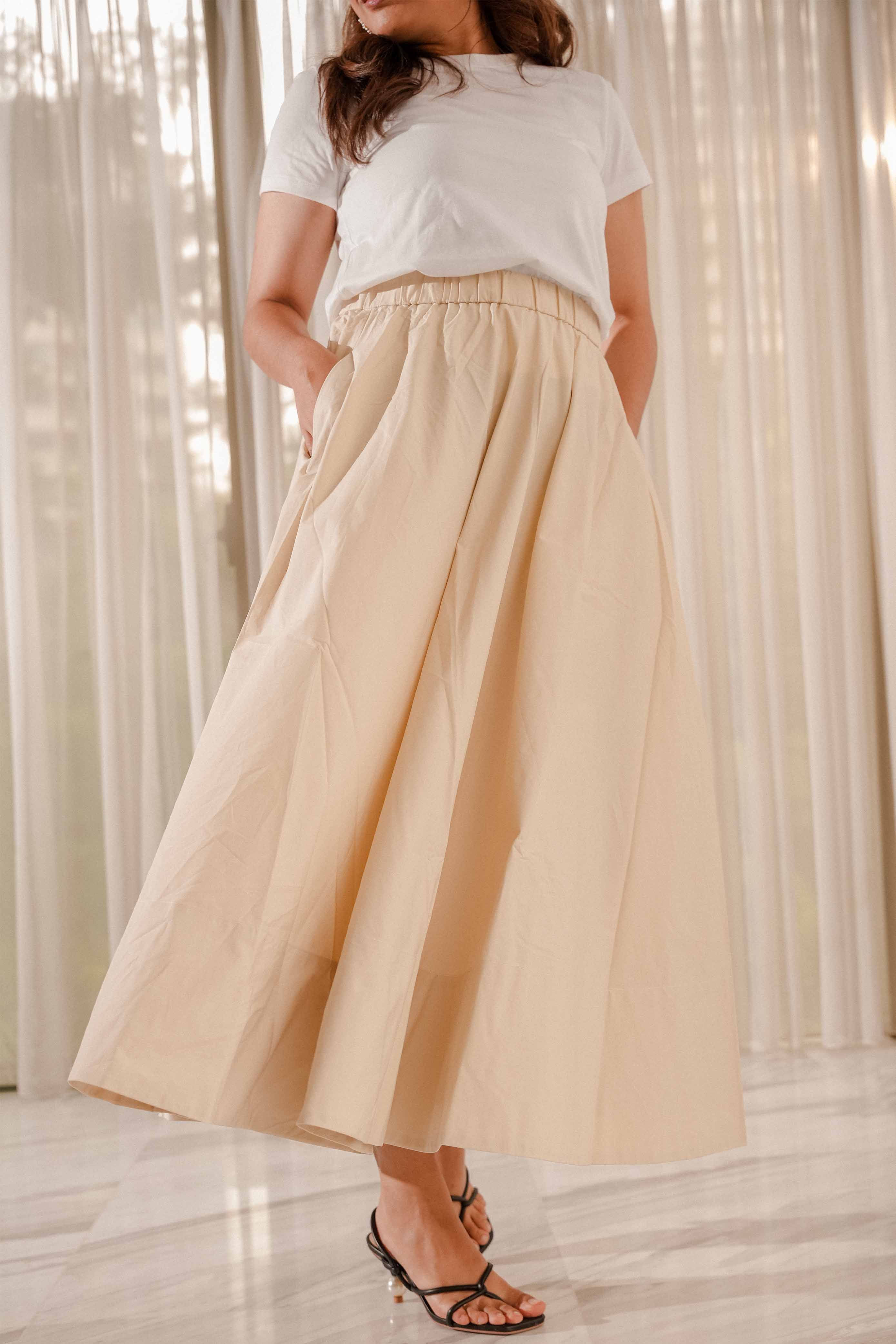 female model in high quality white top and light brown skirt by petit moi