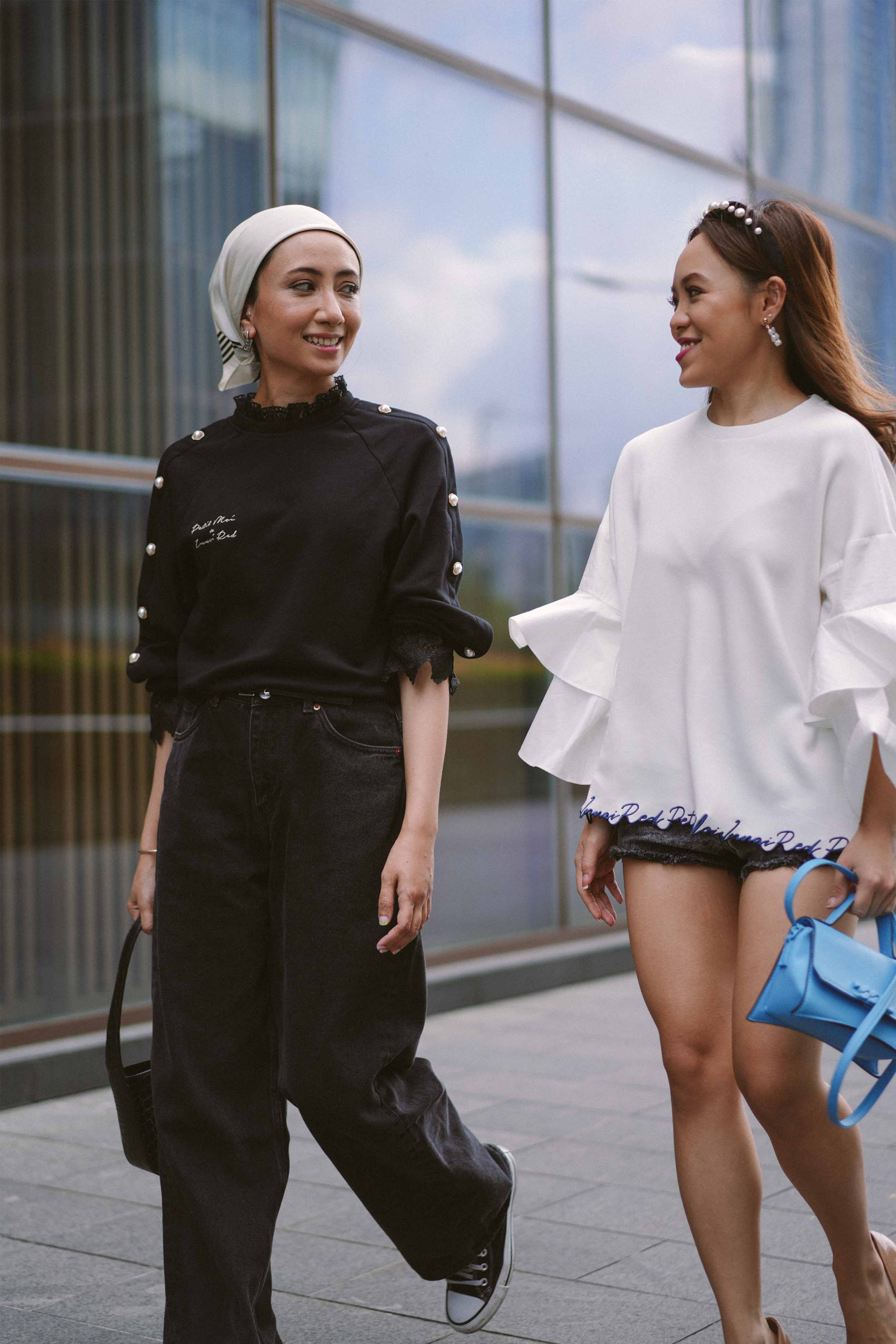 best friends walking in the streets of kuala lumpur in their favourite clothes from petit moi