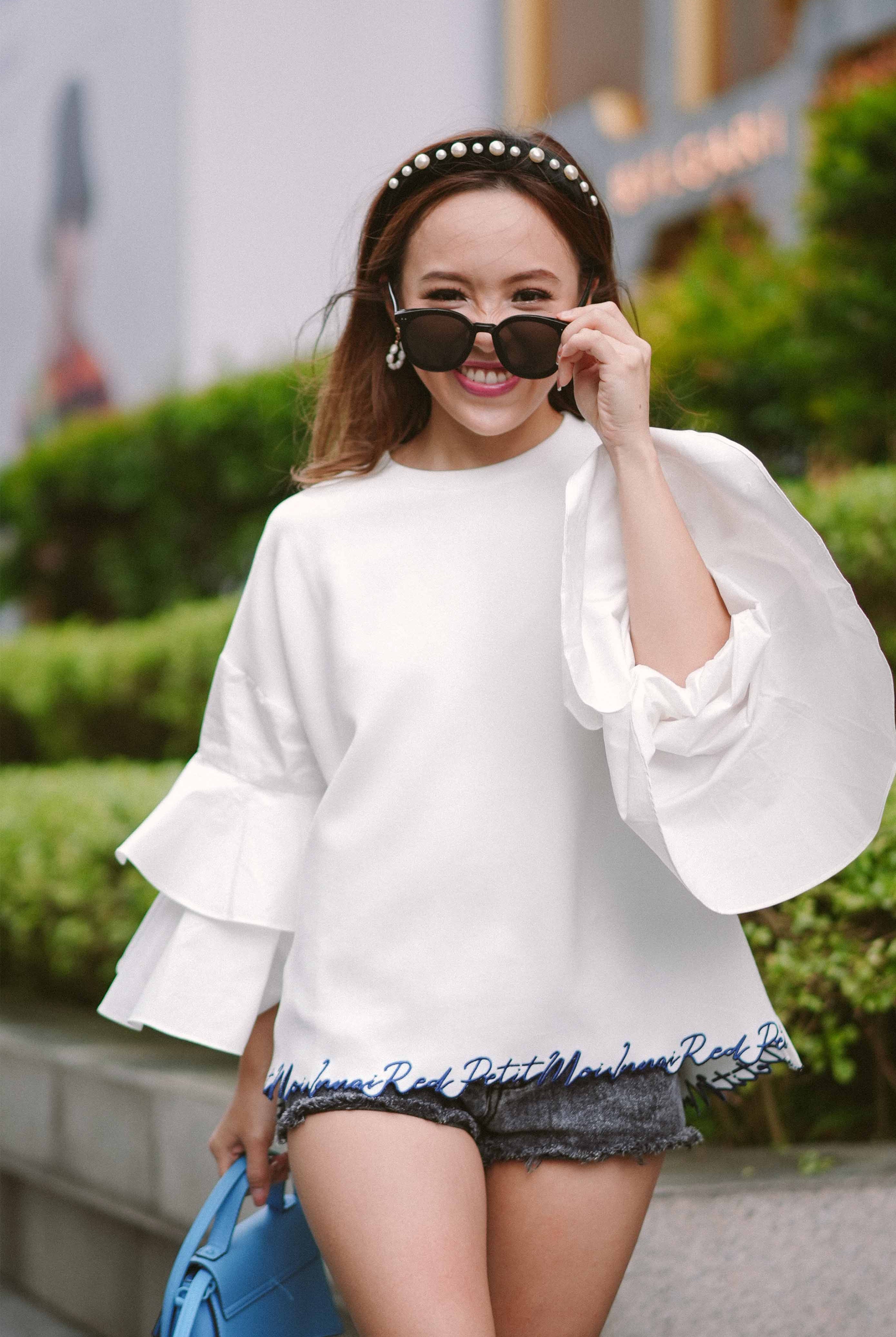 female model in white blouse by petit moi