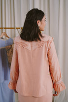 back shot of pink dress worn by female model 