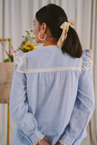 back shot of striped blue baju kurung worn by female model